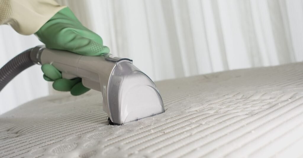 Toronto homeowner cleaning upholstery sofa fabric at home using microfiber cloth and spray solution - TidyUp HandyCrew guide 2026
